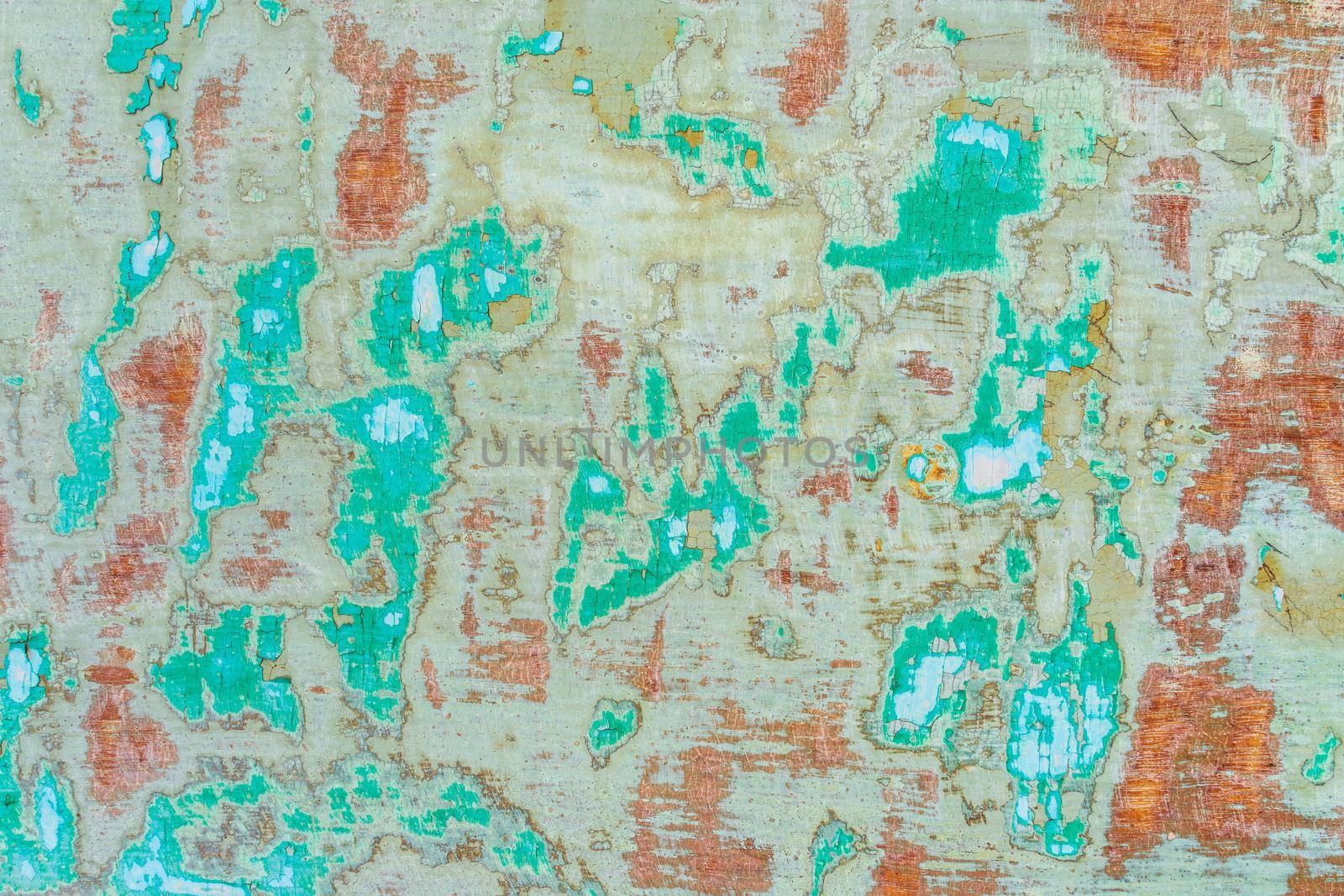 Old background cracked paint on wooded door background. Aged grunge teal background. Teal and green color tone.