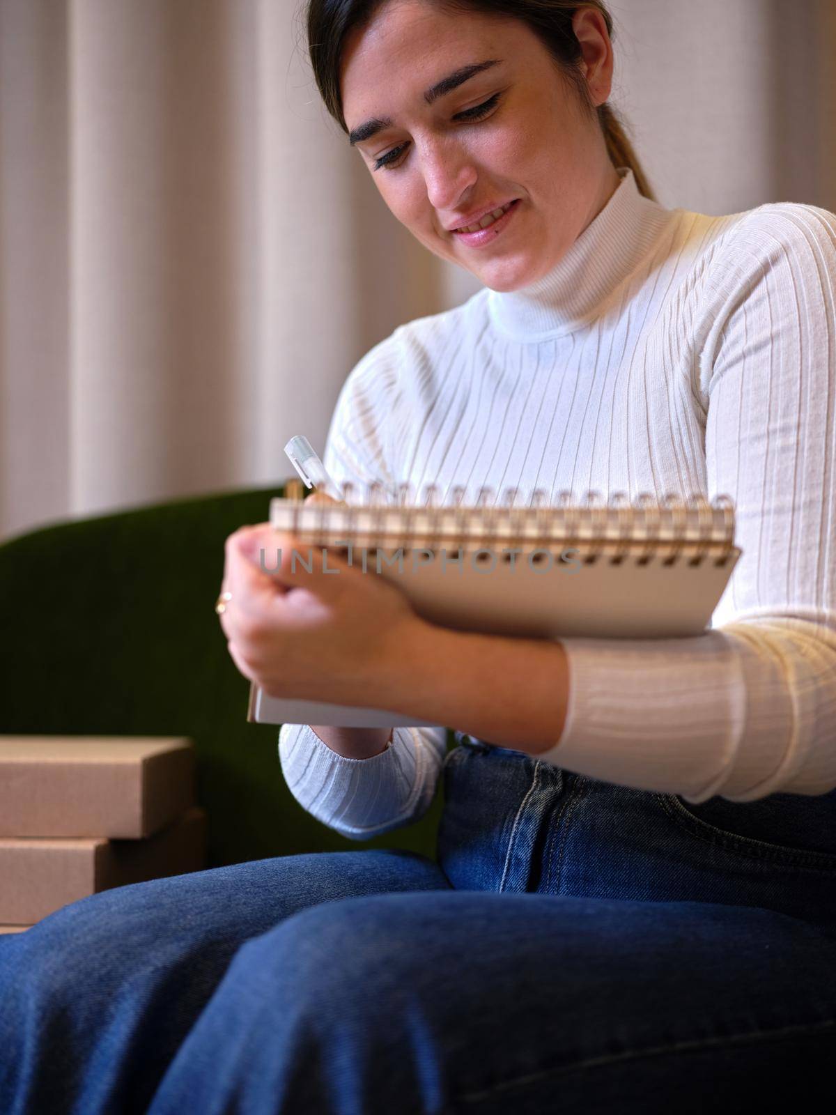 portrait of a young woman writing in a notebook sitting by WesternExoticStockers