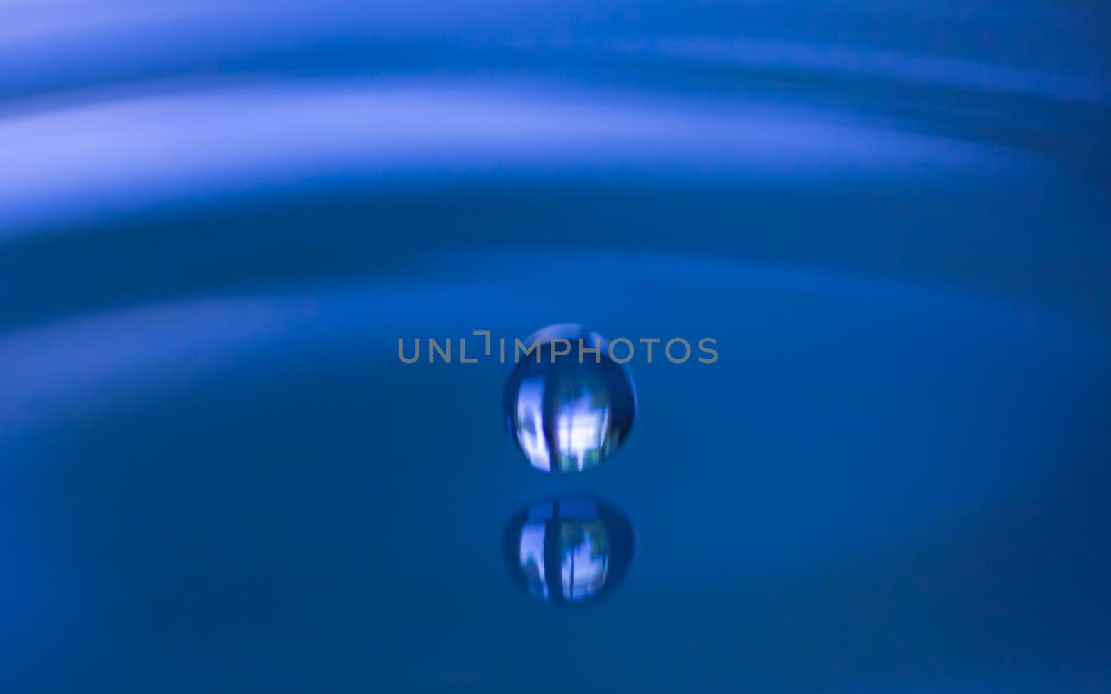 Light blue color drop in  water and splash creative forms  made