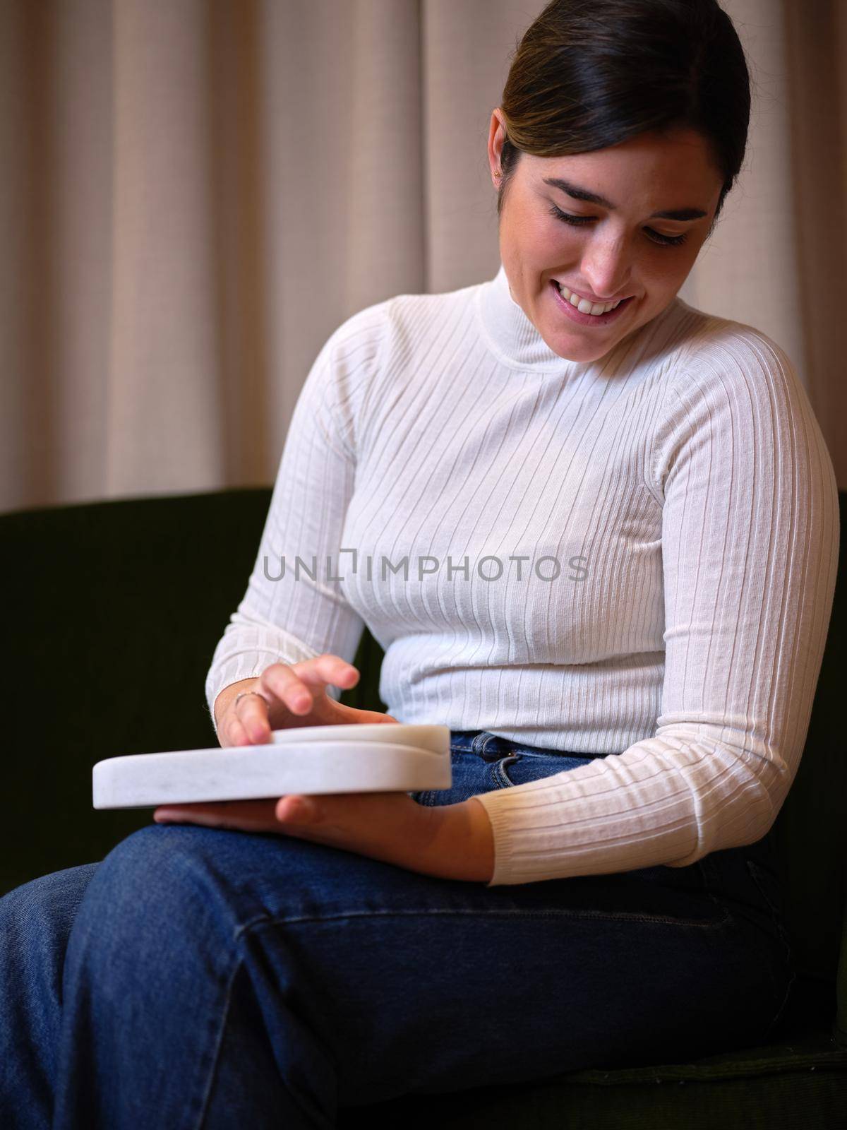 smiling woman in a white pullover sitting using her new product by WesternExoticStockers