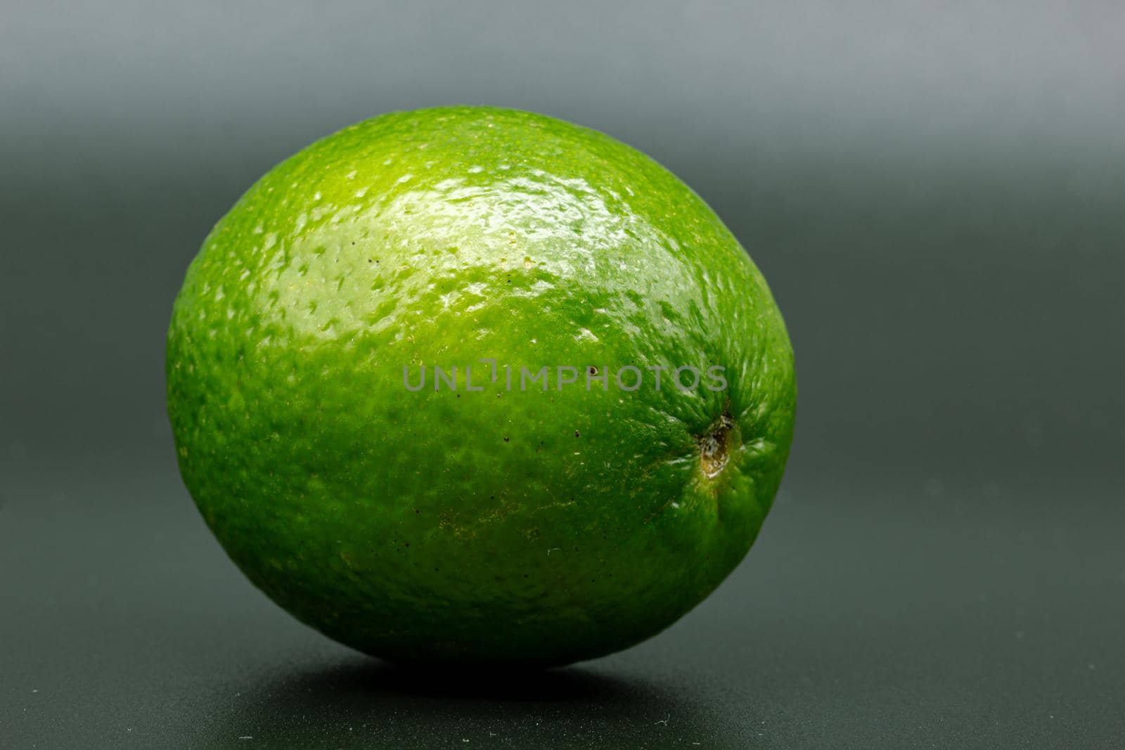 Green lime citruss fruit textured peel by scudrinja