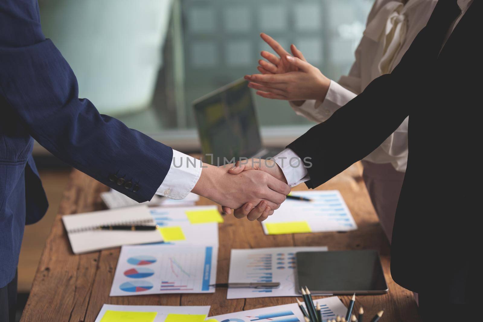 Business partnership meeting concept. Image businessmans handshake. Successful businessmen handshaking after good deal. Group support concept. by itchaznong
