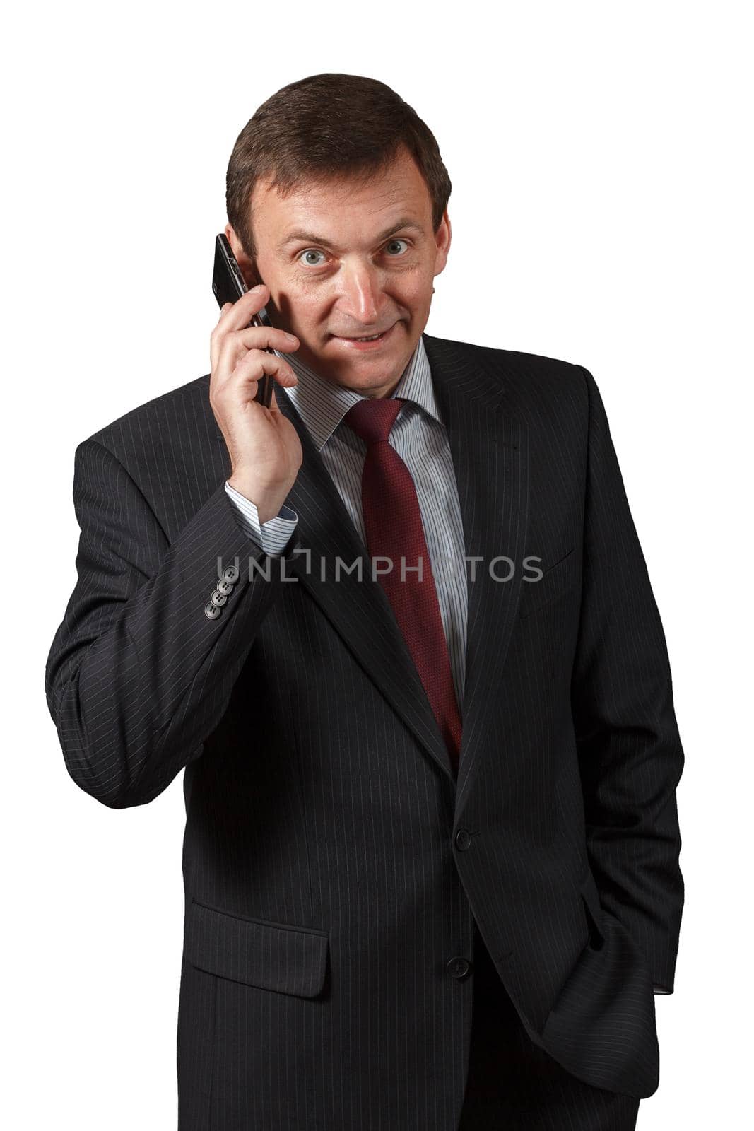 Confident elegant handsome mature businessman wearing a nice suit is speaking on the sell phone on white isolated background