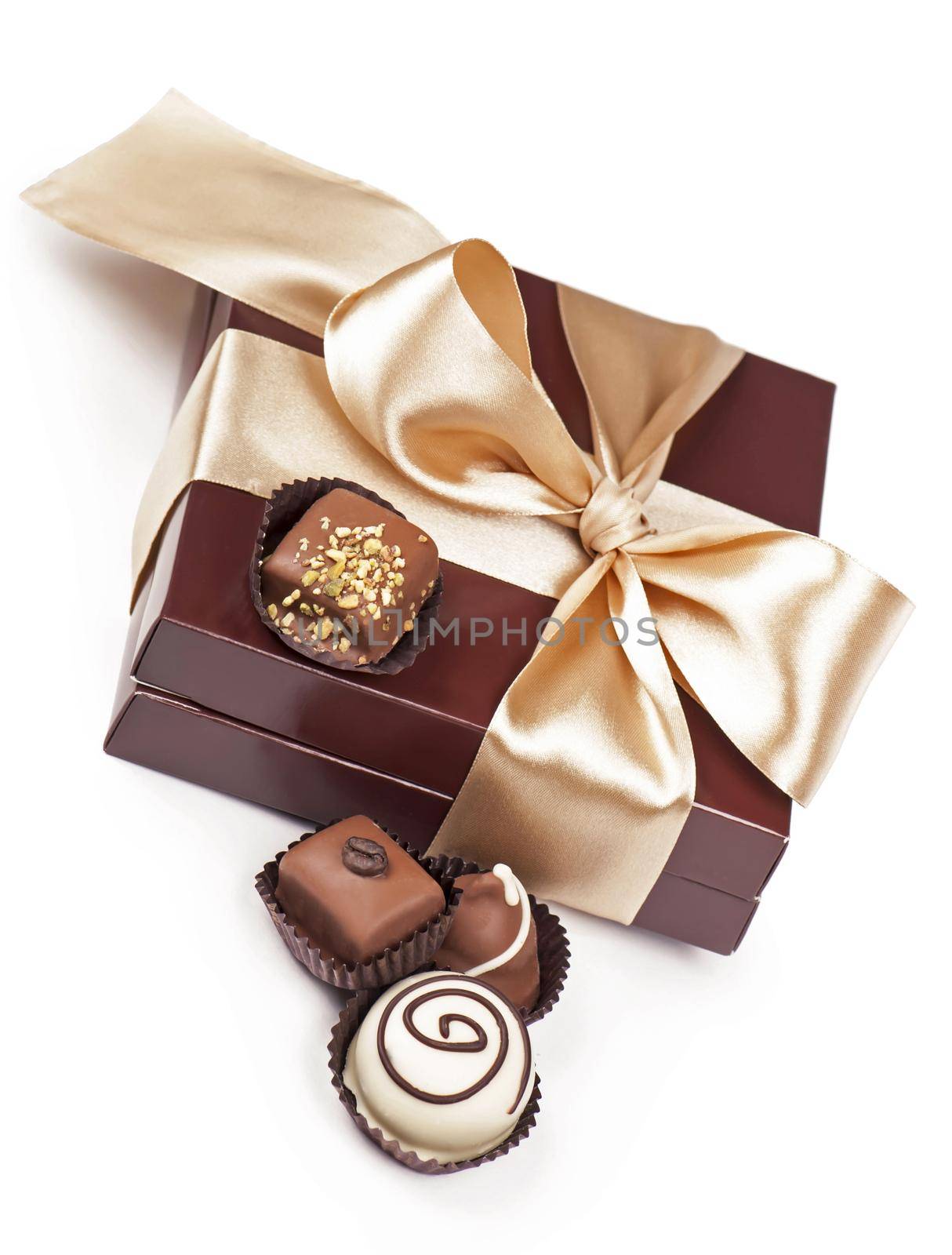 brown box with candies and golden tape by aprilphoto