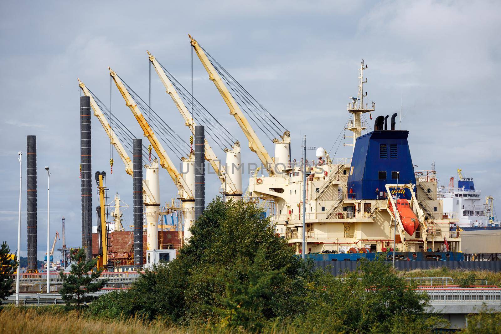 Freight port sea terminal, Lifting port cranes and sea containers in the cargo seaport.