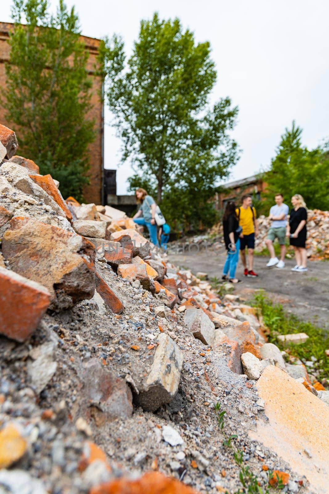 Piles of old red bricks and stones from ruins of old buildings