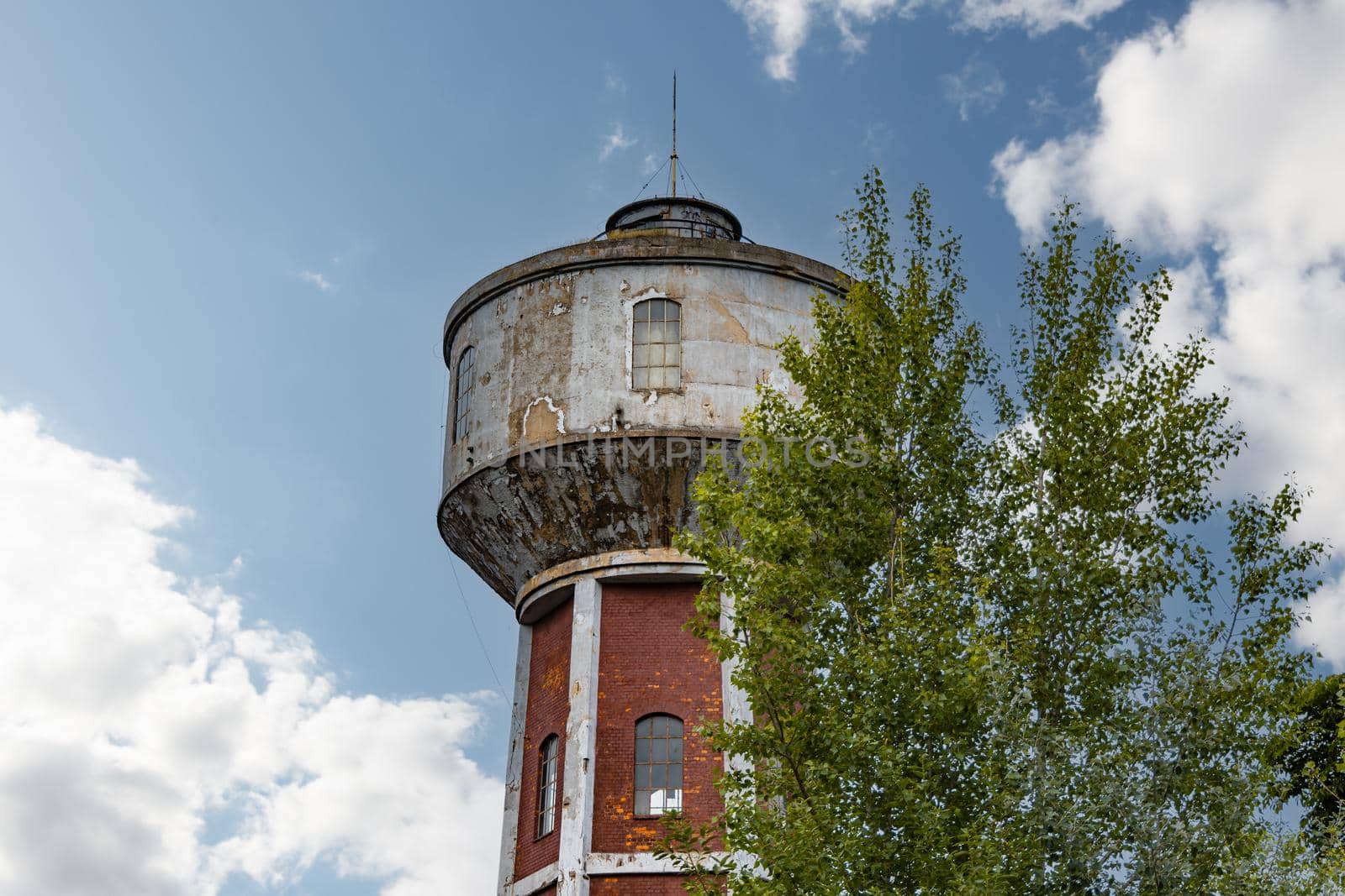 High red brick tower as part of old factory complex