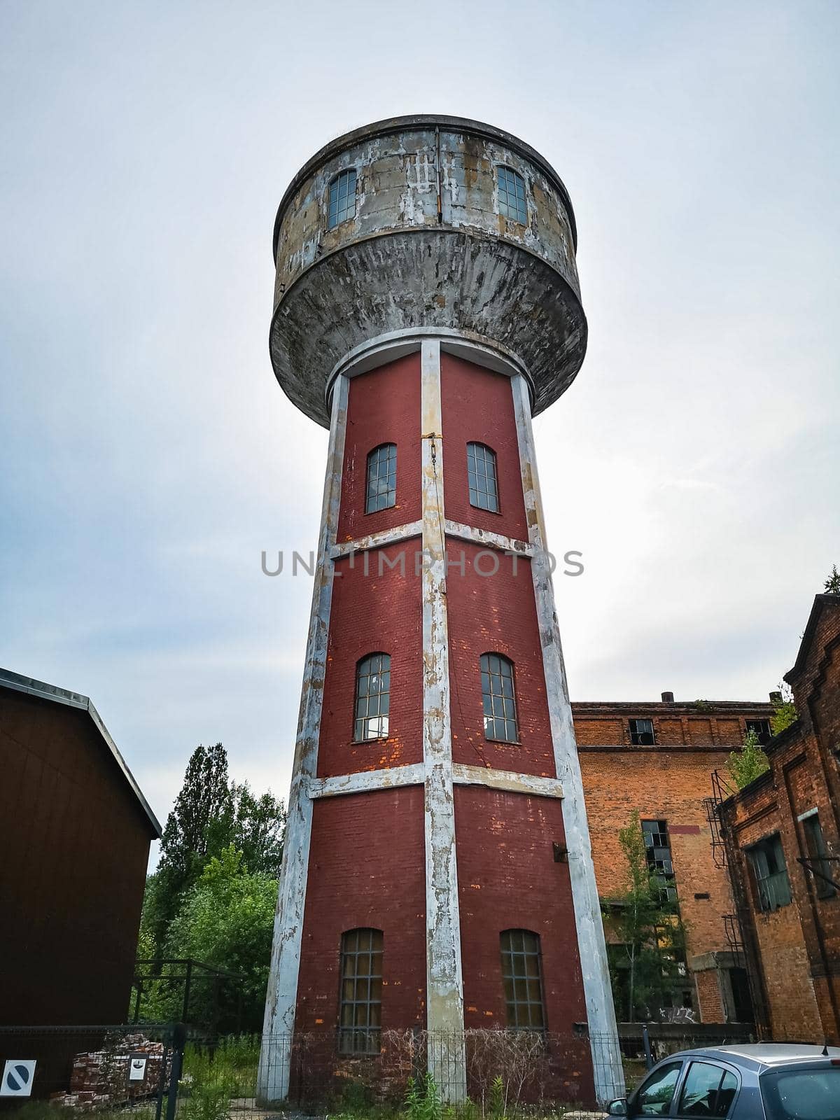 High red brick tower as part of old factory complex