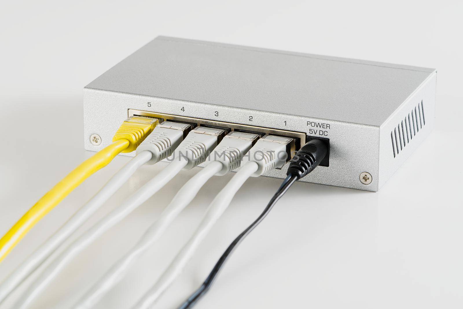 Small router and switch. tcp ip network business concept. High - performance gigabit switch. home network gray switch.