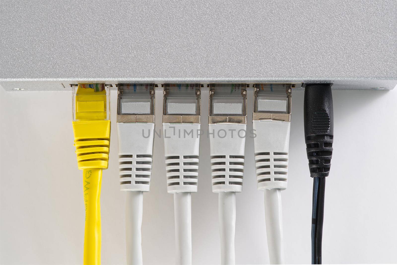 Small router and switch. tcp ip network business concept. High - performance gigabit switch. home network gray switch.