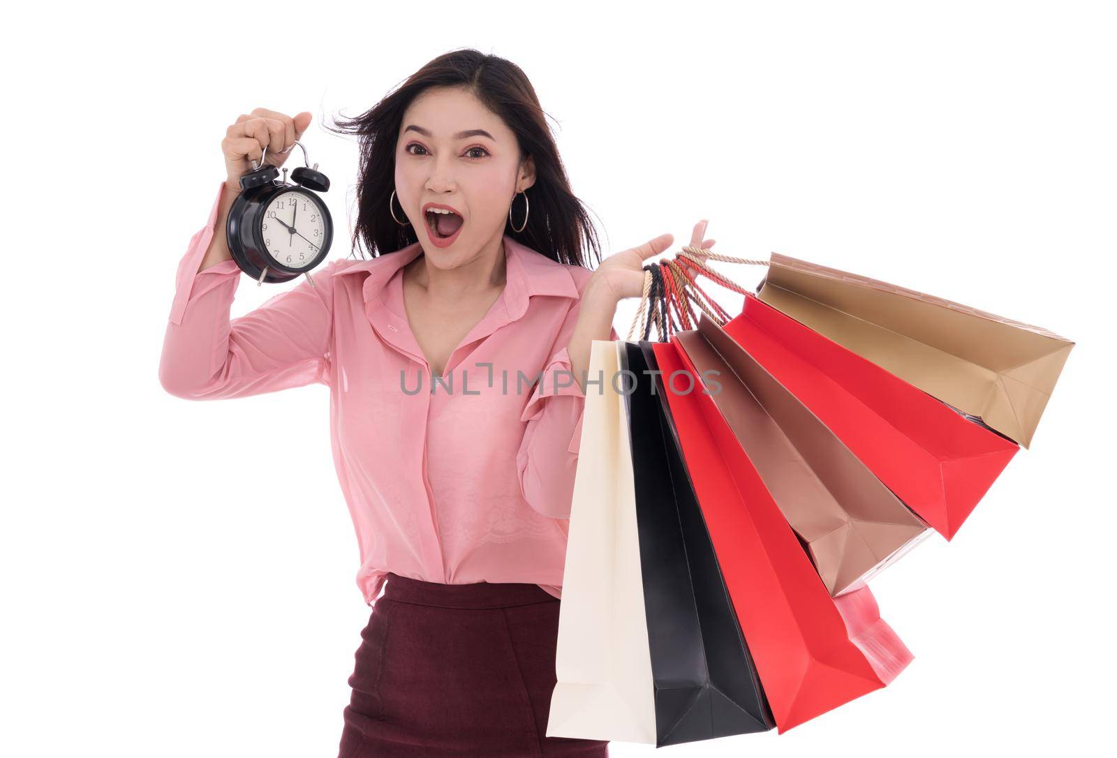 happy woman holding shopping bag and clock isolate on a white background