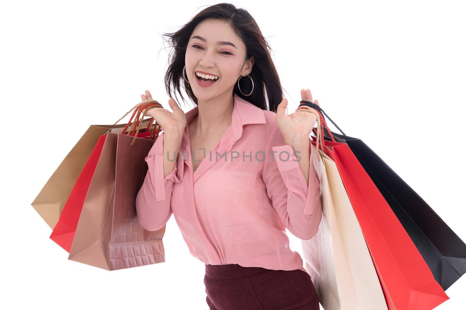 cheerful woman holding shopping bag isolated on a white background by geargodz