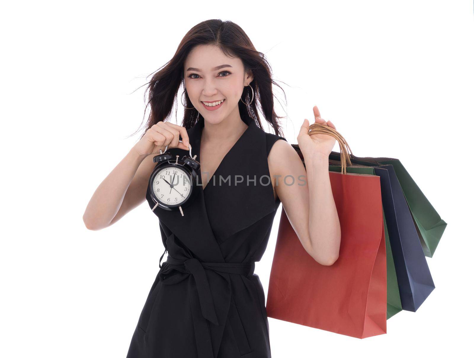 Caption/Description: happy woman holding shopping bag and clock isolate on white background by geargodz