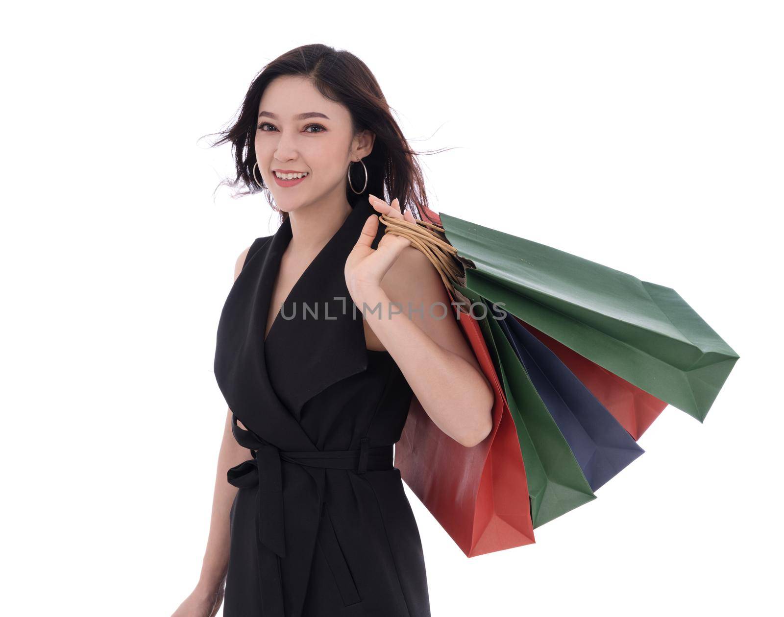 cheerful young woman holding shopping bag isolated on white background by geargodz