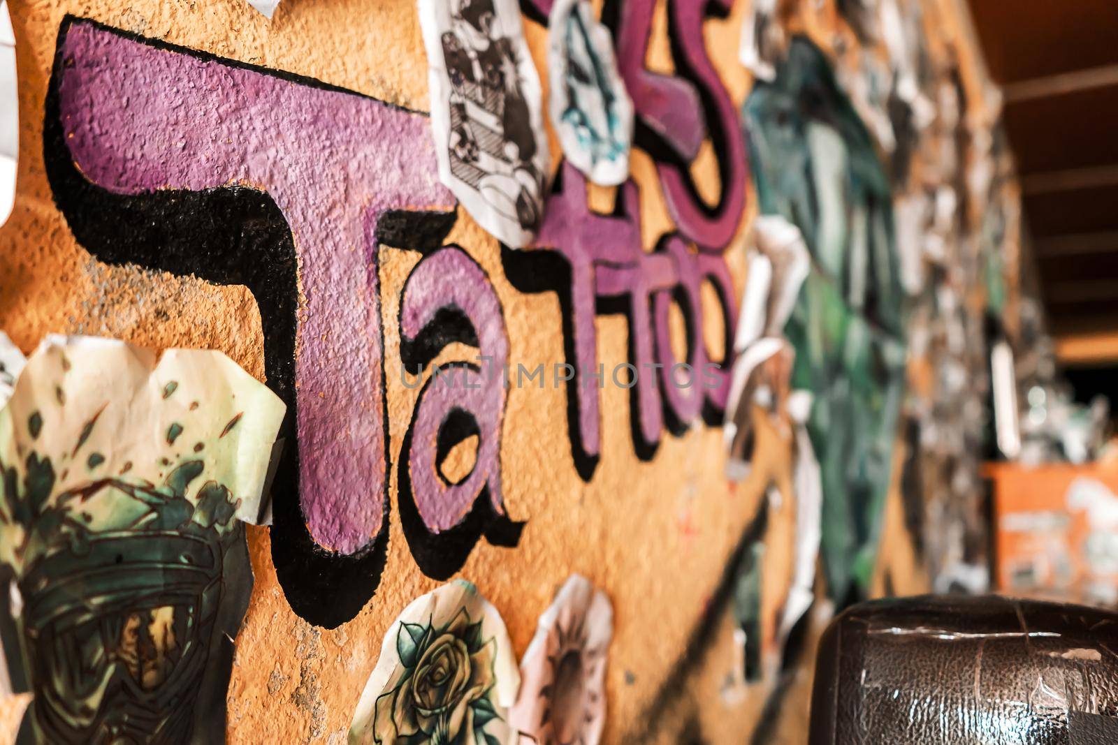 Tattoo studio wall in a salon in Latin America by cfalvarez