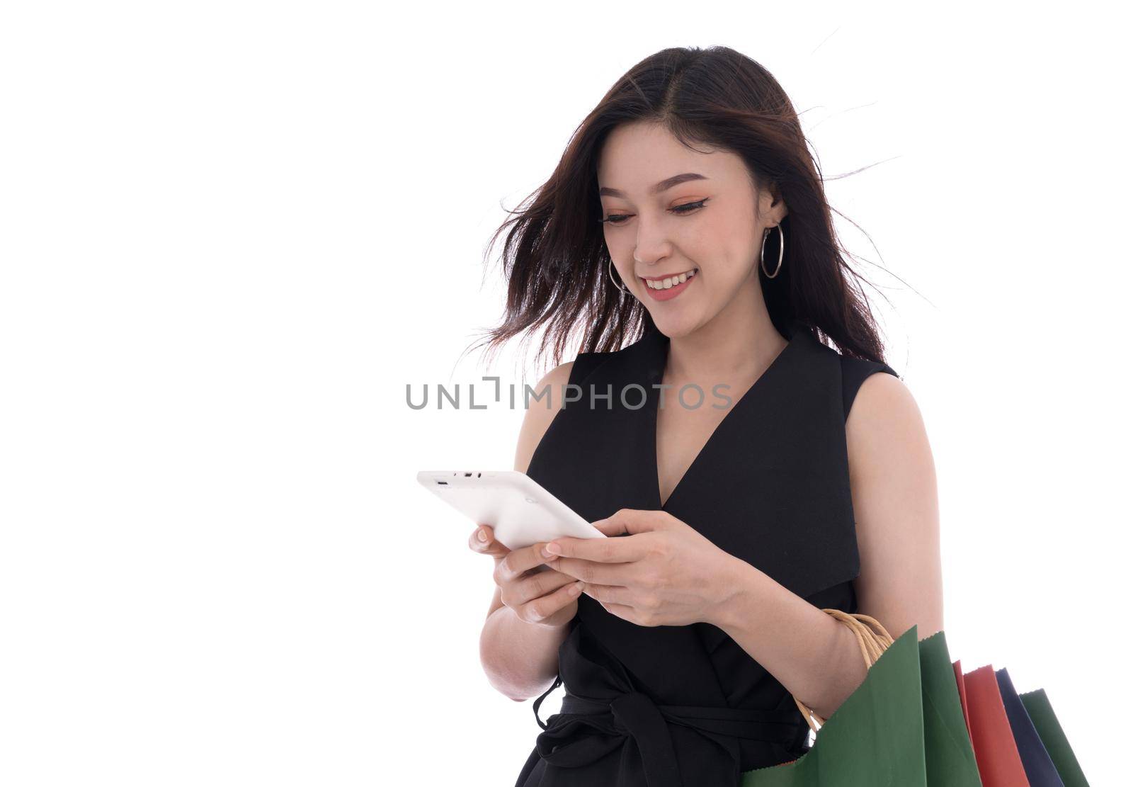 young woman shopping and using digital tablet isolated on a white background