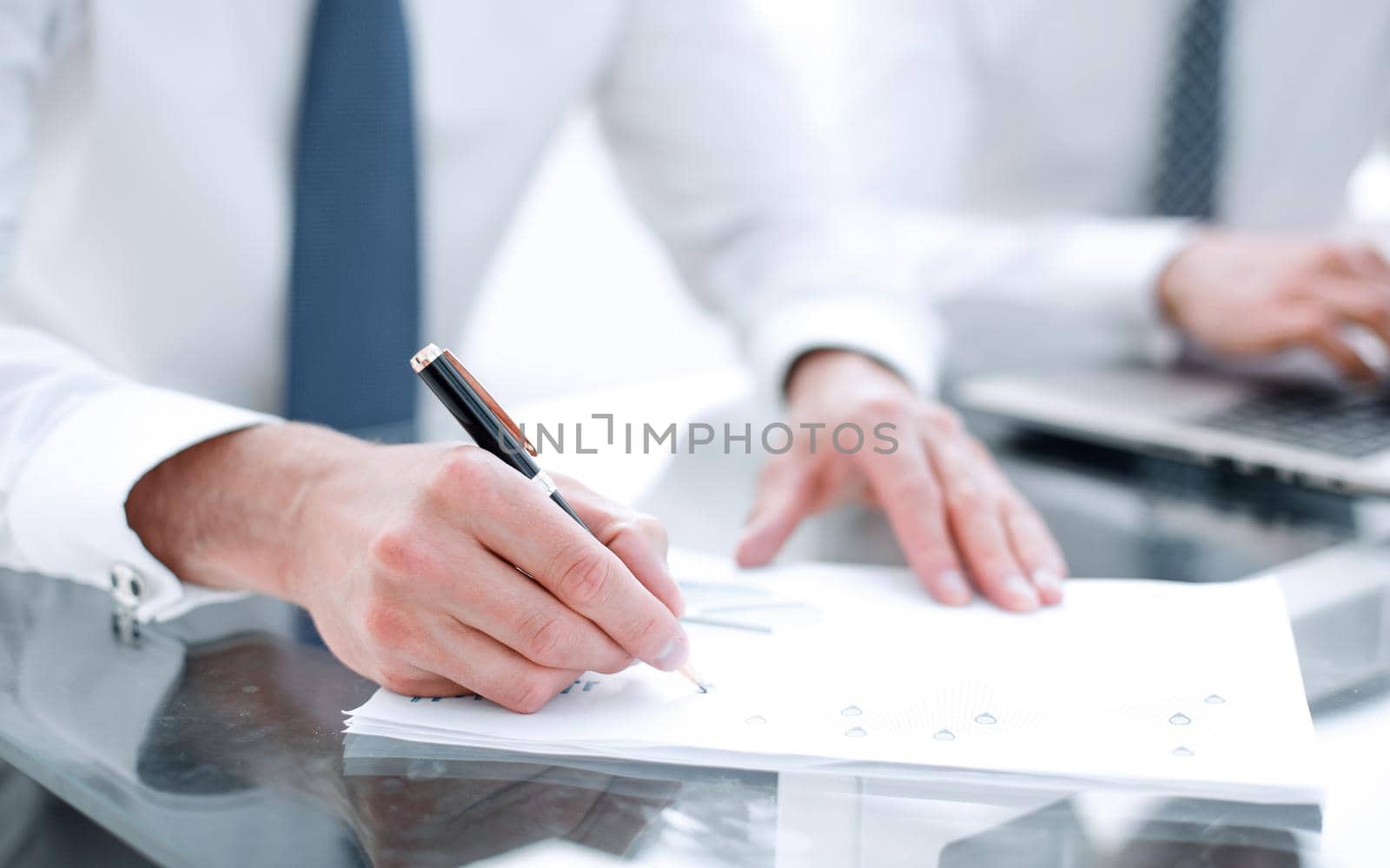 close up.businessman checking financial report.business concept