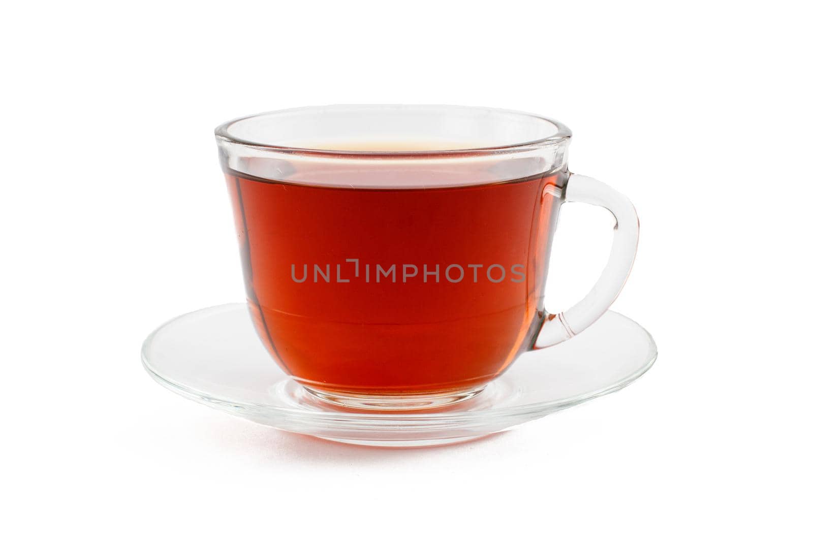 Glass cup of black tea with saucer on white isolated background