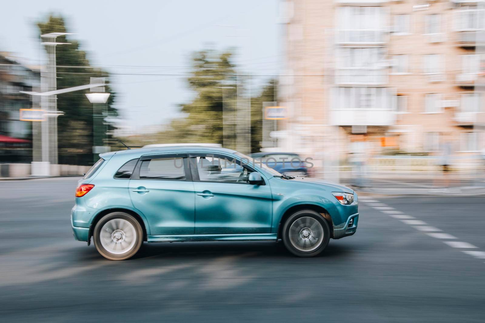 Ukraine, Kyiv - 16 July 2021: Green Mitsubishi car moving on the street. Editorial