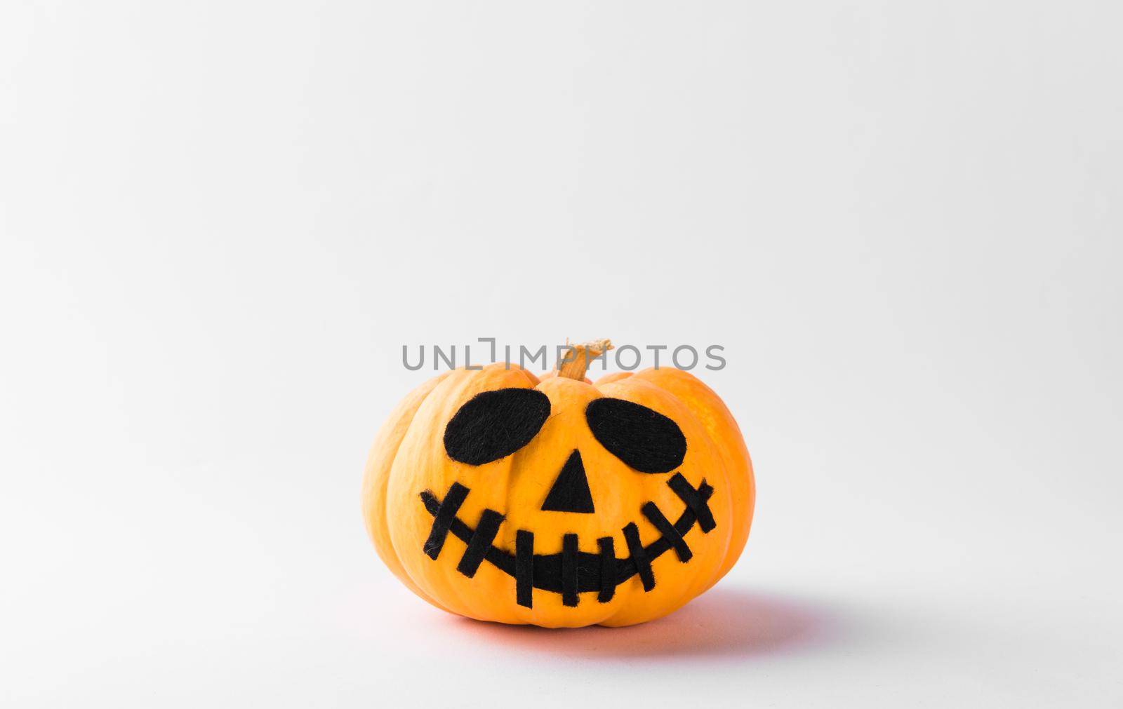 Funny Halloween day party concept ghost pumpkin head jack lantern scary smile, studio shot isolated on white background, Holiday decoration