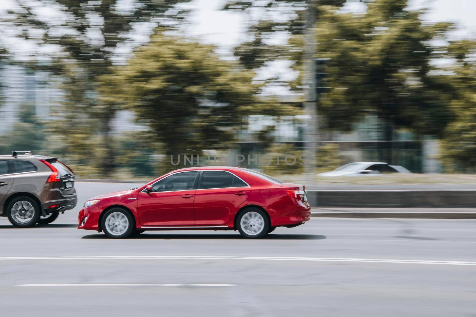 Ukraine, Kyiv - 27 June 2021: Red Toyota Camry car moving on the street. Editorial
