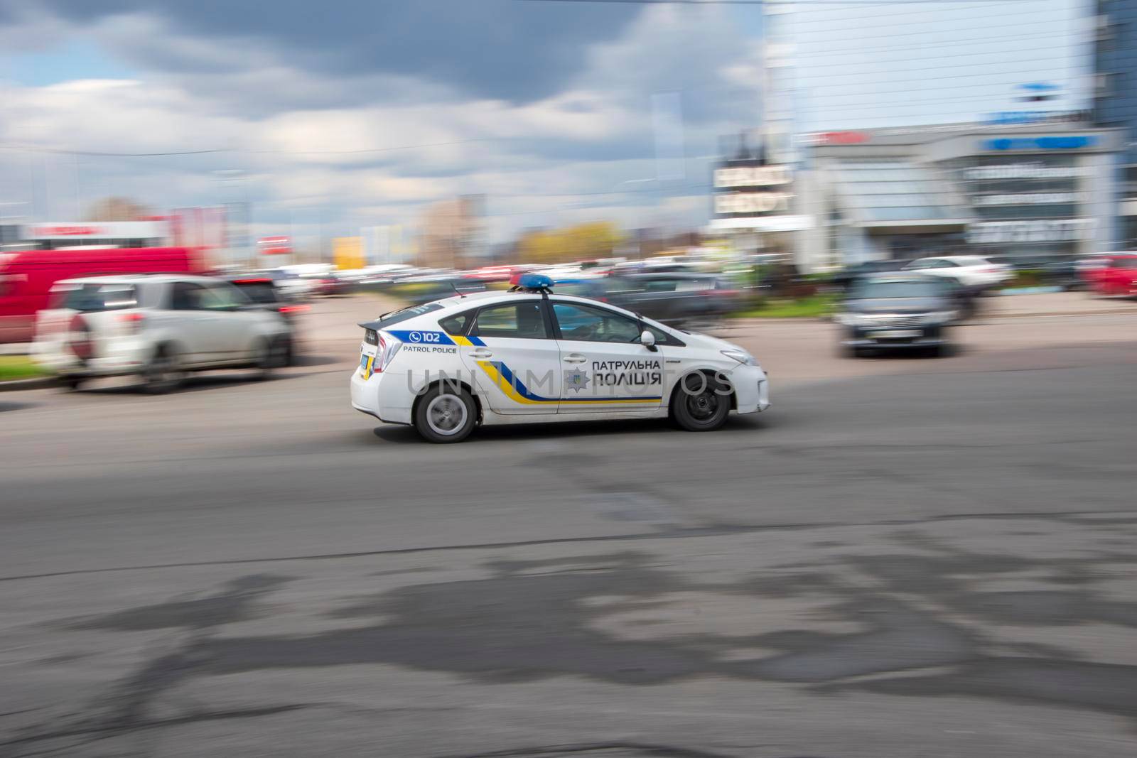 Ukraine, Kyiv - 26 April 2021: White Toyota Prius car moving on the street. Editorial