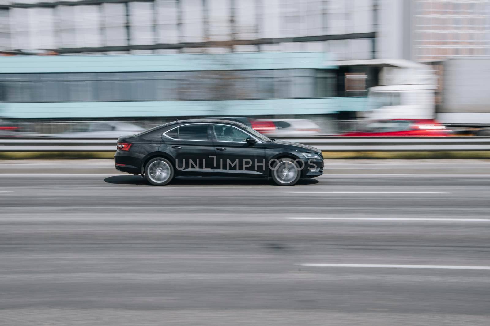 Ukraine, Kyiv - 29 April 2021: Black Skoda Superb car moving on the street. Editorial