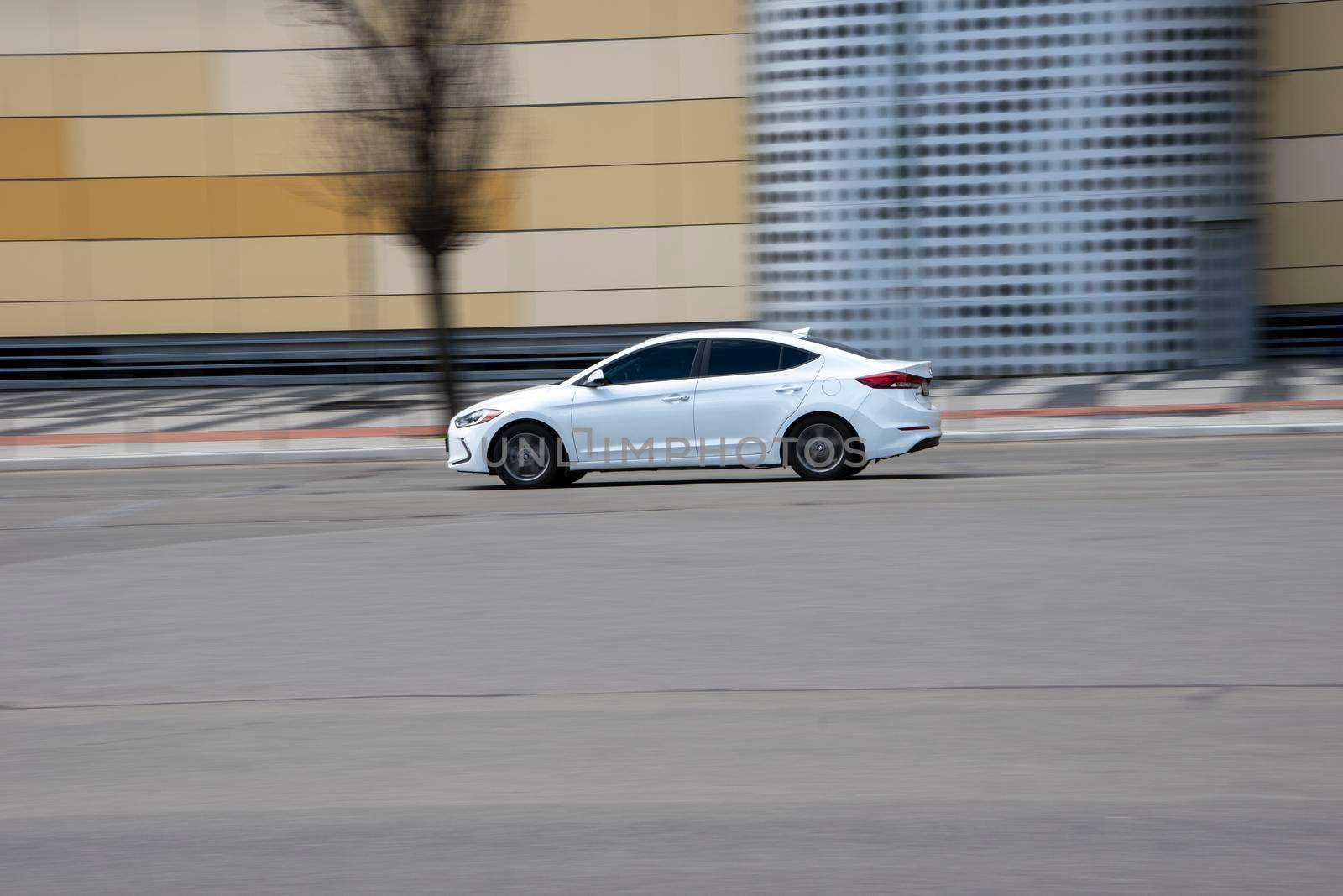 Ukraine, Kyiv - 26 April 2021: White Hyundai Elantra car moving on the street. Editorial