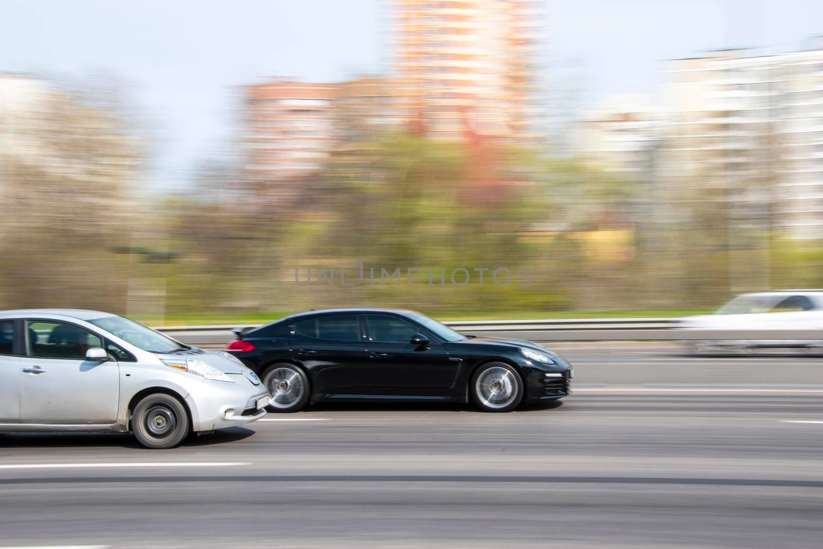 Ukraine, Kyiv - 20 April 2021: Black Porsche Panamera car moving on the street. Editorial