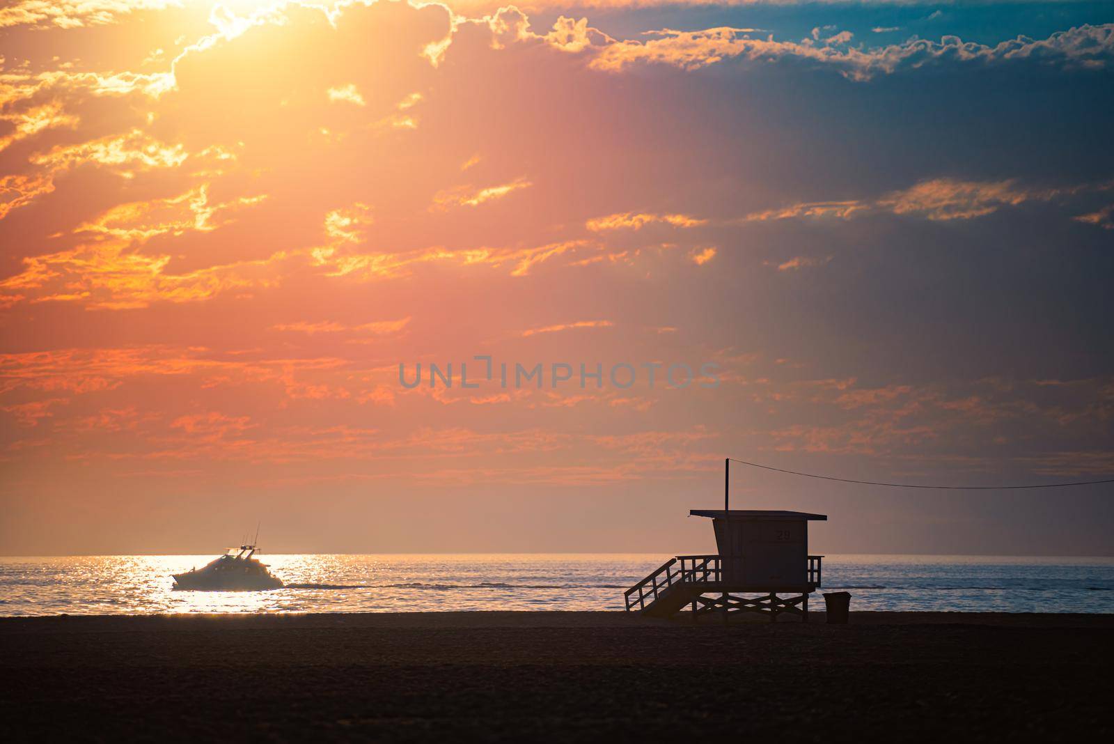 Lifeguard crew watching ocean at sunset in Santa Monica, California, United States of America