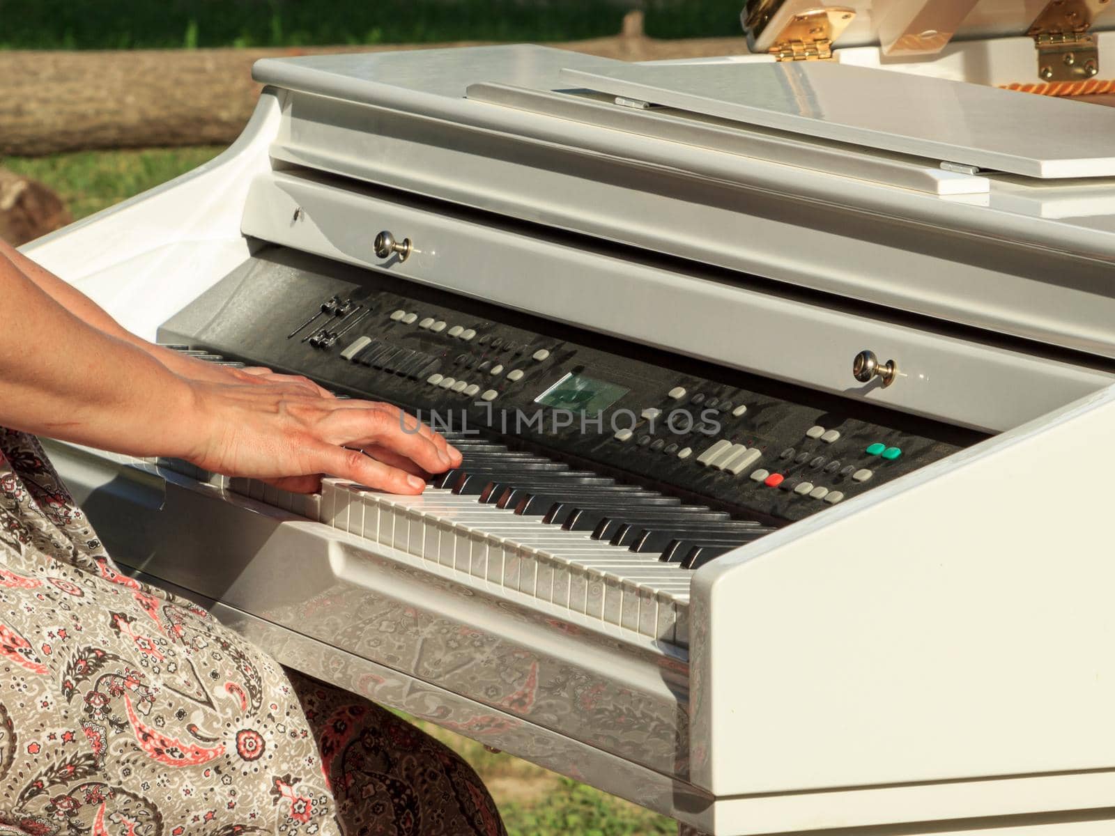 Lady playing white electric piano by scudrinja