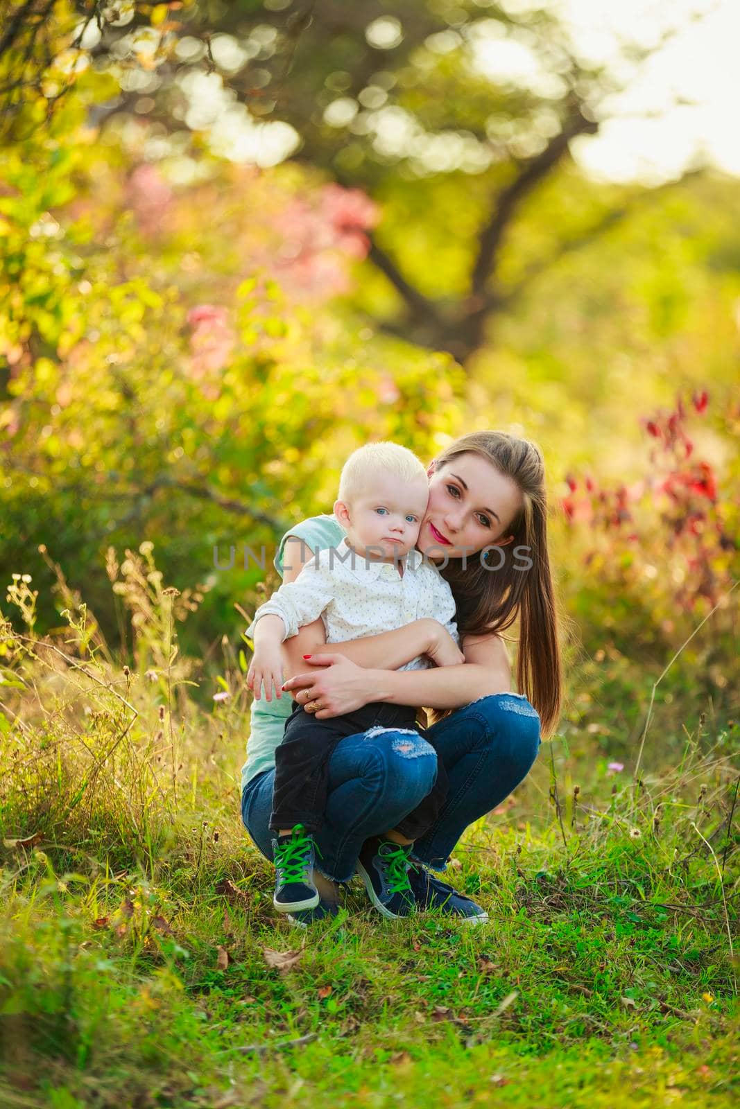 mother and son in nature by zokov