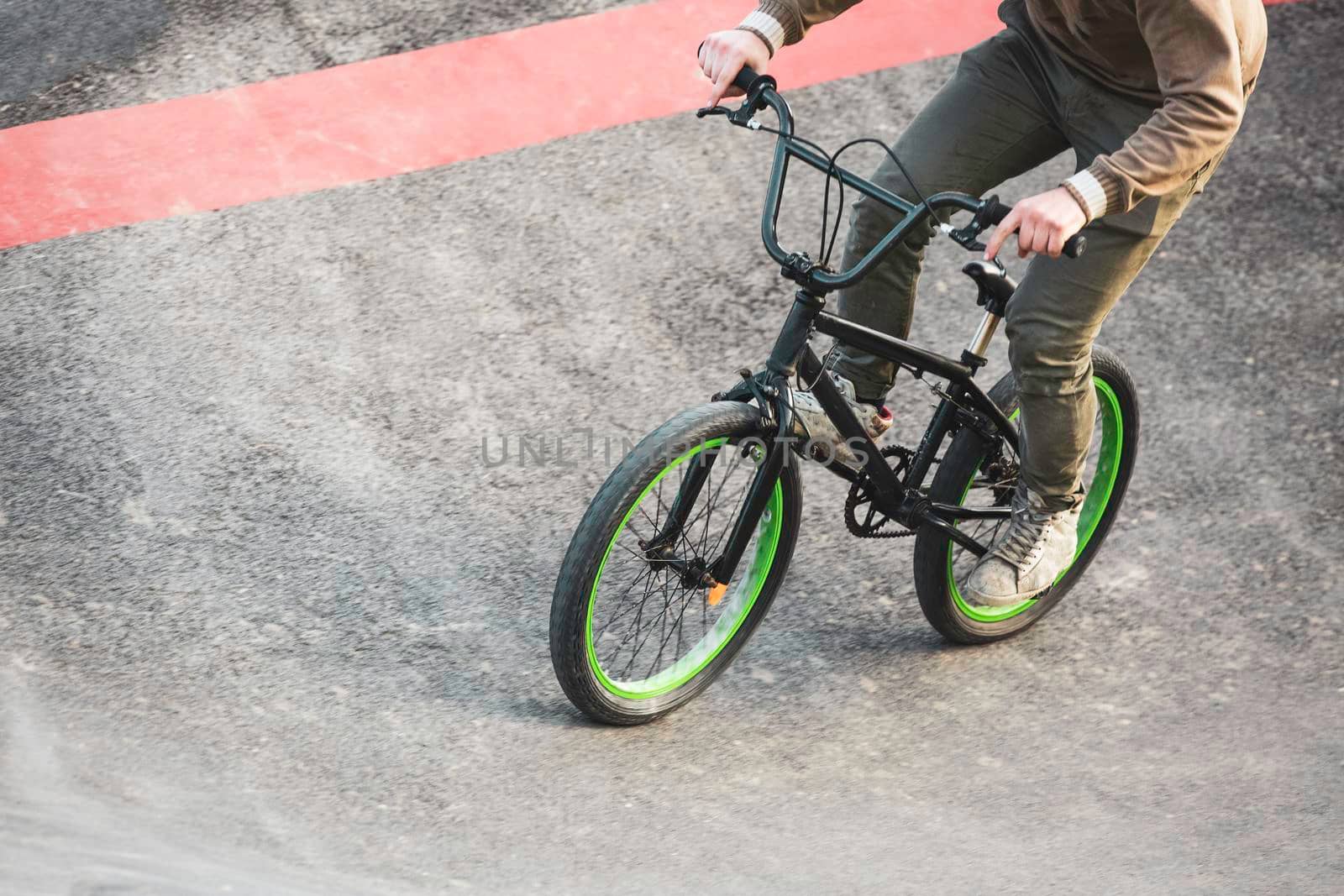 biker at speed bike park circuit by contas