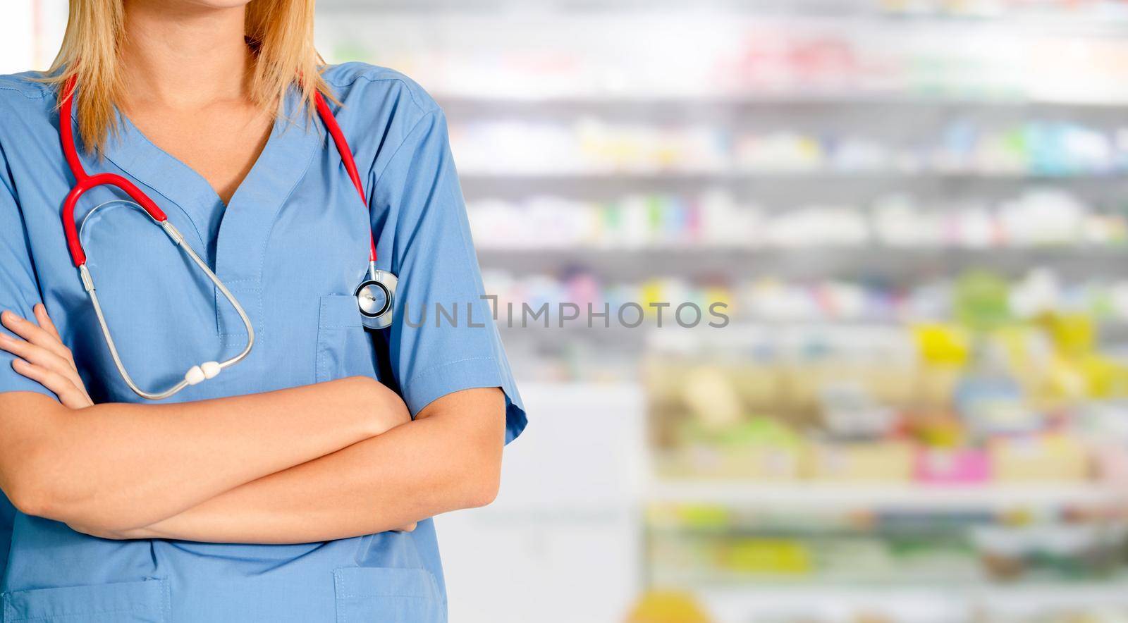 Woman pharmacist working at pharmacy. by biancoblue