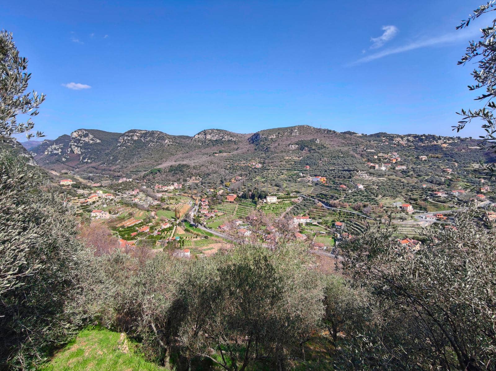 landscape of the hinterland of Finale Ligure, coastal landscape with fields and mountains 