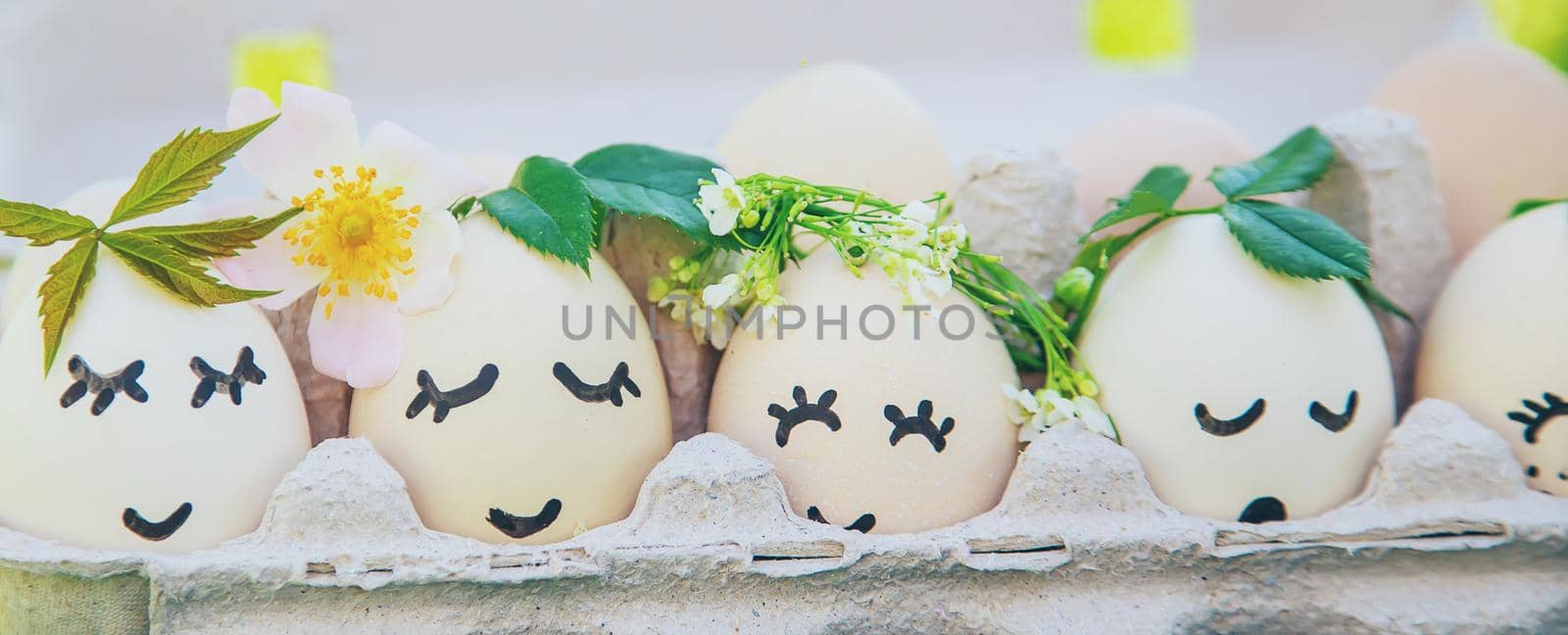 homemade eggs with beautiful faces and a smile. Selective focus. by yanadjana