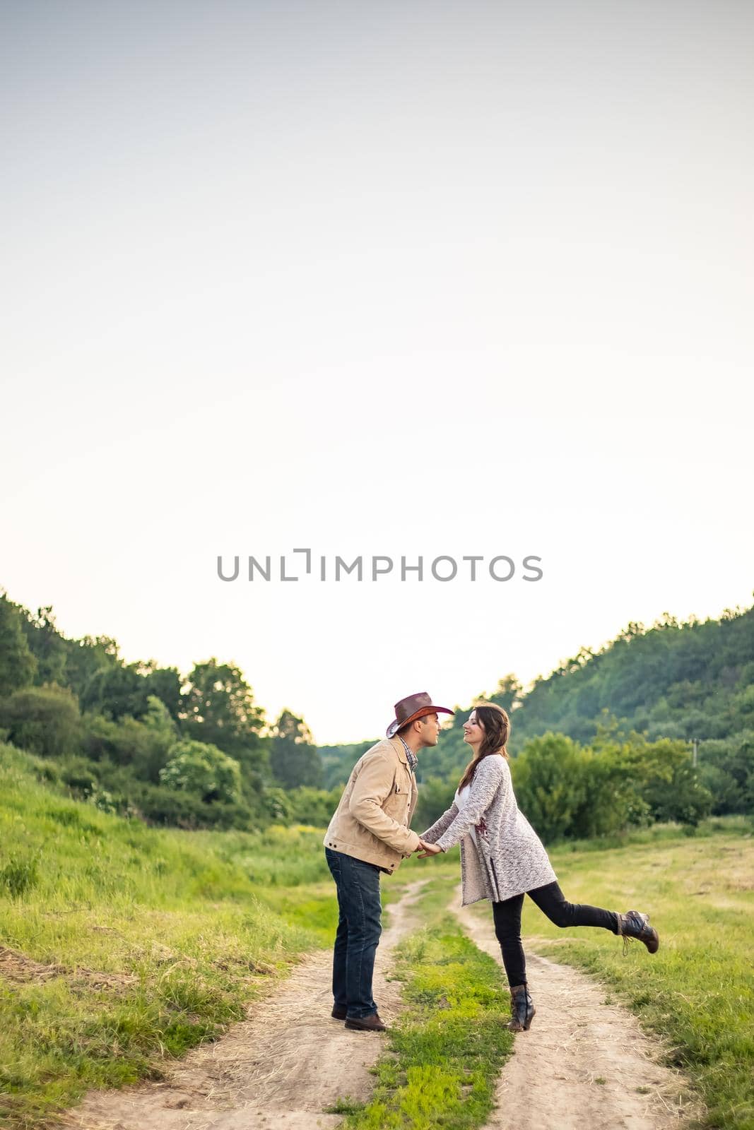 nice portrait of beautiful and young groom and bride outdoors