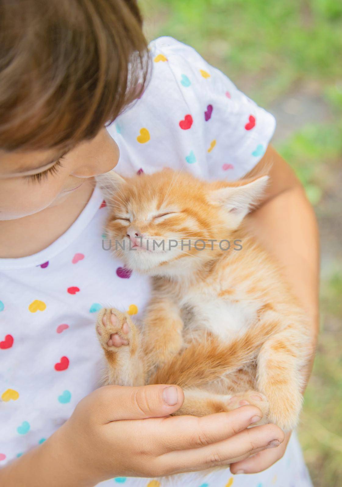 Little kittens in the hands of children. Selective focus. by yanadjana