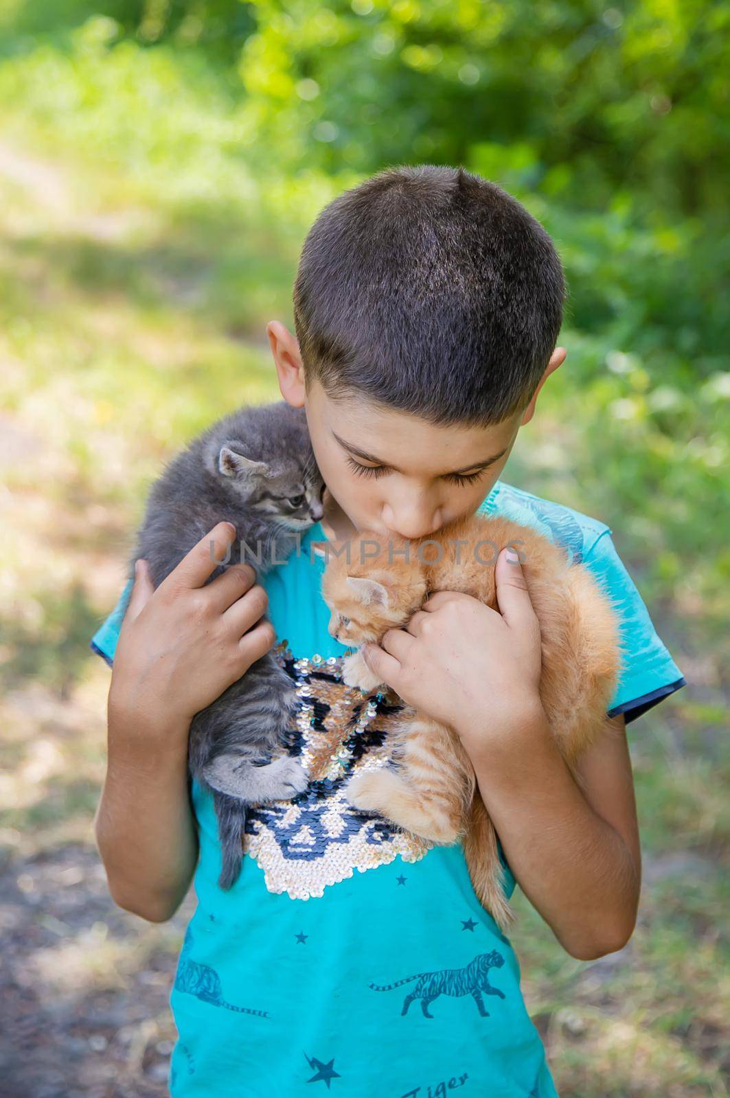 Little kittens in the hands of children. Selective focus.