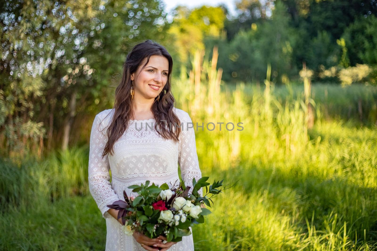 Beautiful Bride wedding day outdoors, happy newlywed woman with marriage flowers bouquet. by Anyatachka