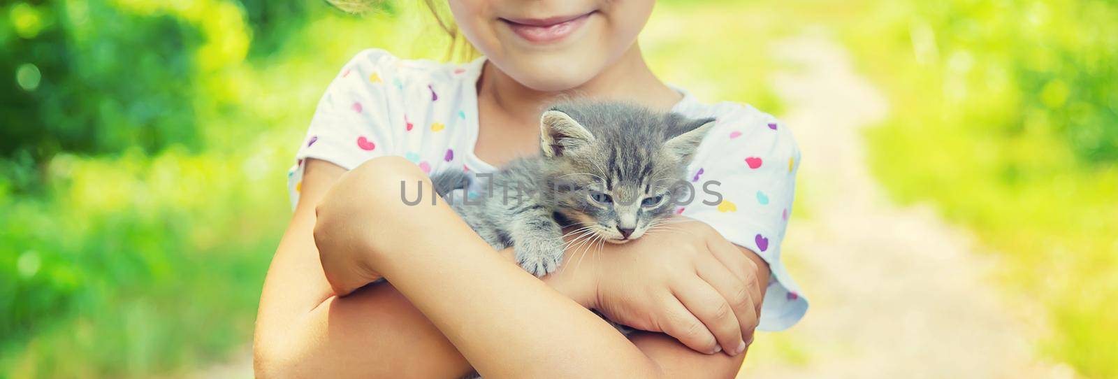 Little kittens in the hands of children. Selective focus.