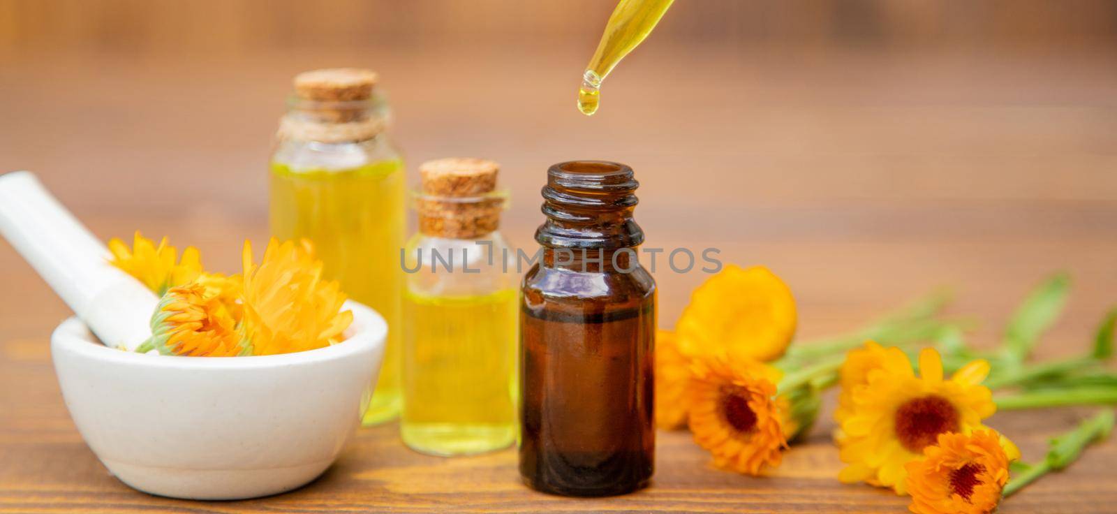 The calendula extract. Medicinal plants. Selective focus. by yanadjana