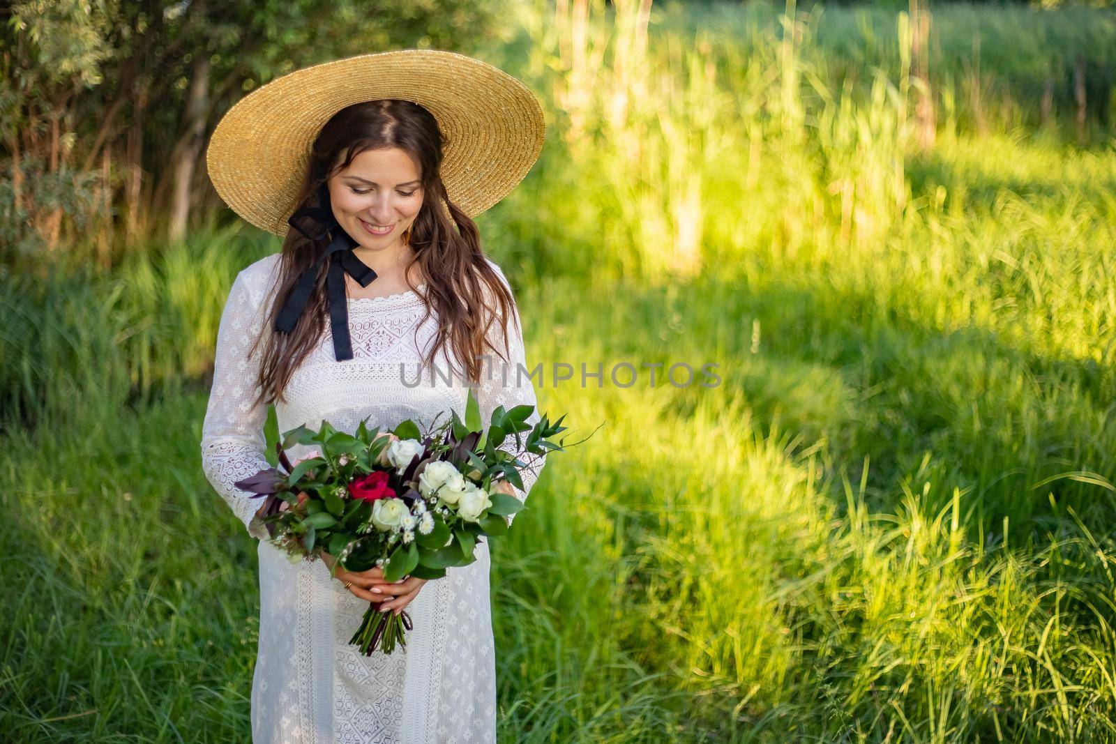 nice portrait of beautiful and young groom and bride outdoors