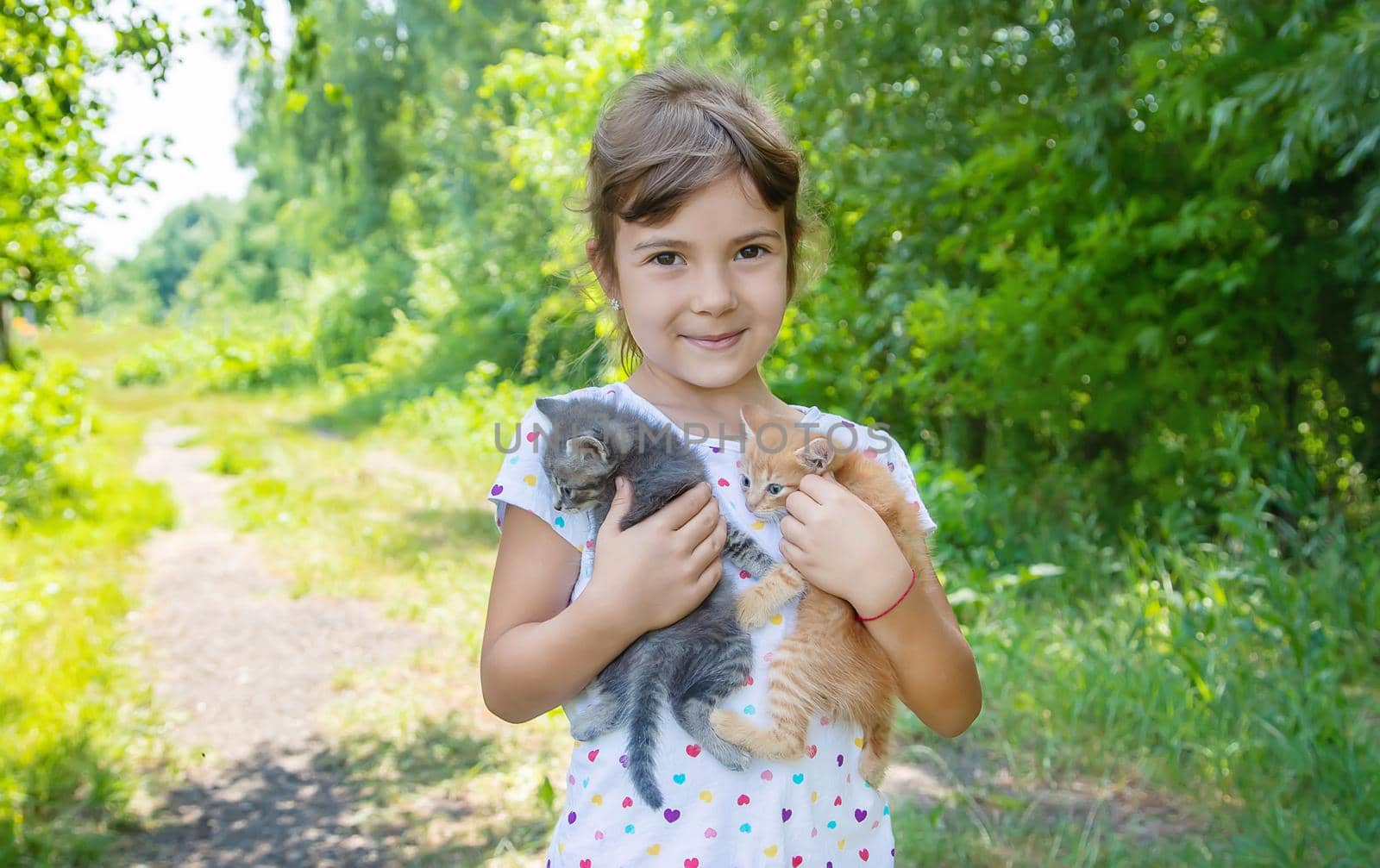 Little kittens in the hands of children. Selective focus.