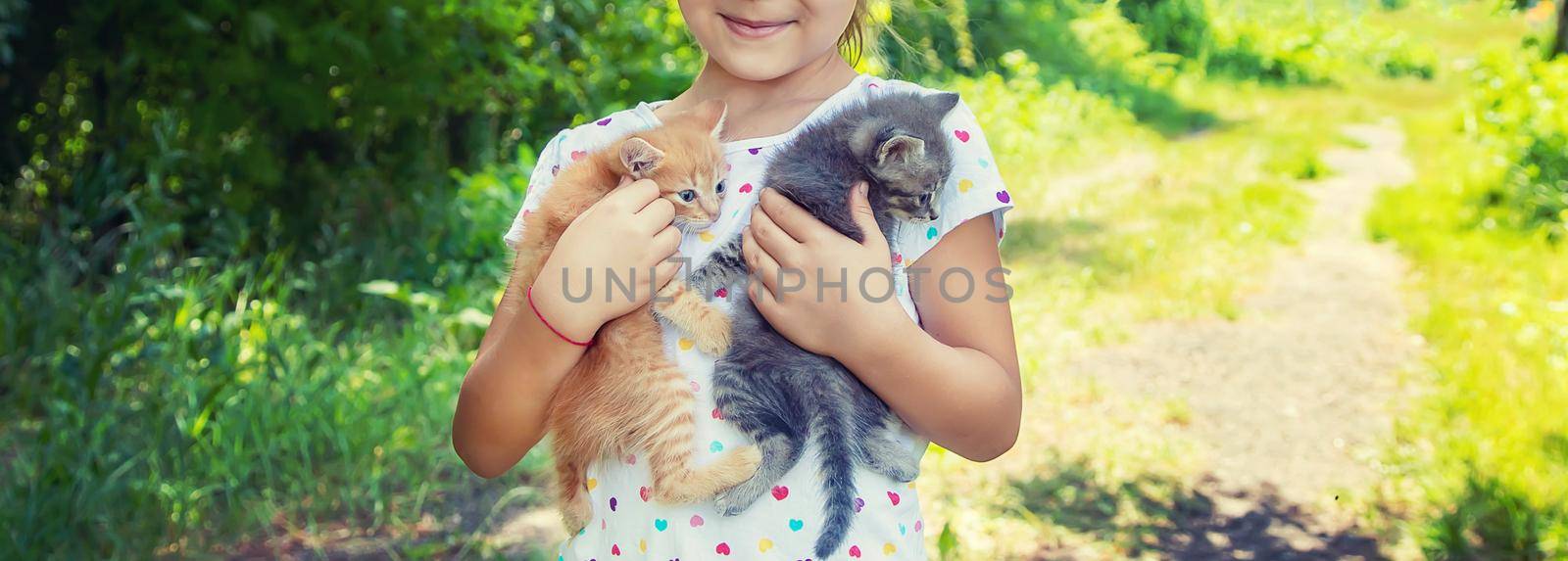 Little kittens in the hands of children. Selective focus. by yanadjana