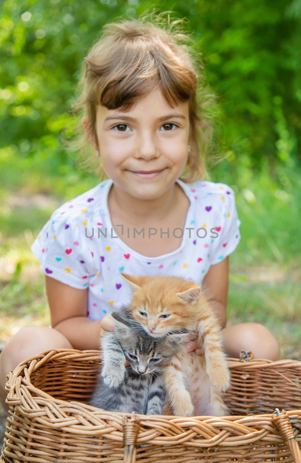 Little kittens in the hands of children. Selective focus.