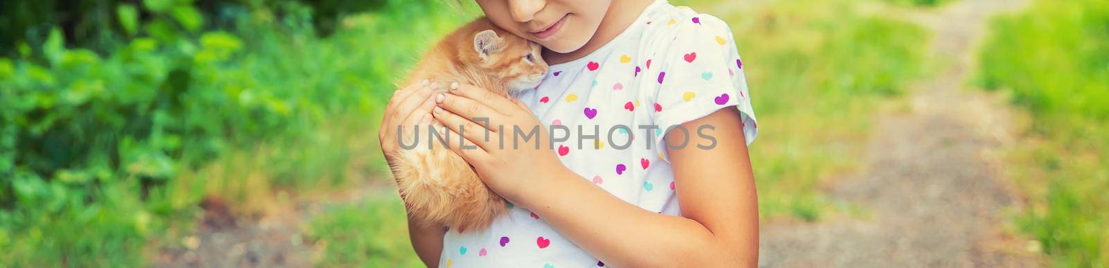 Little kittens in the hands of children. Selective focus.