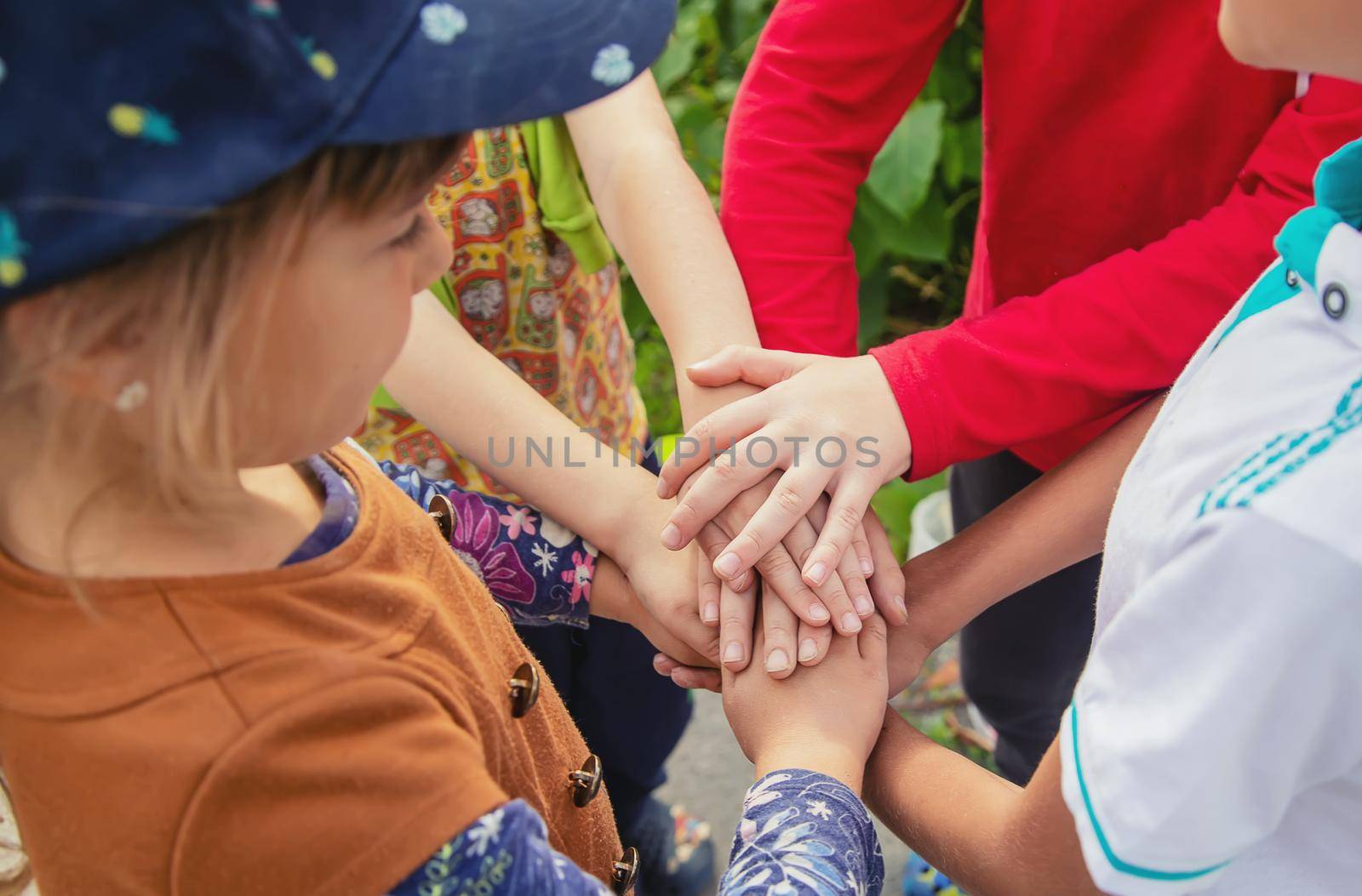 hands of children, many friends, games. Selective focus summer