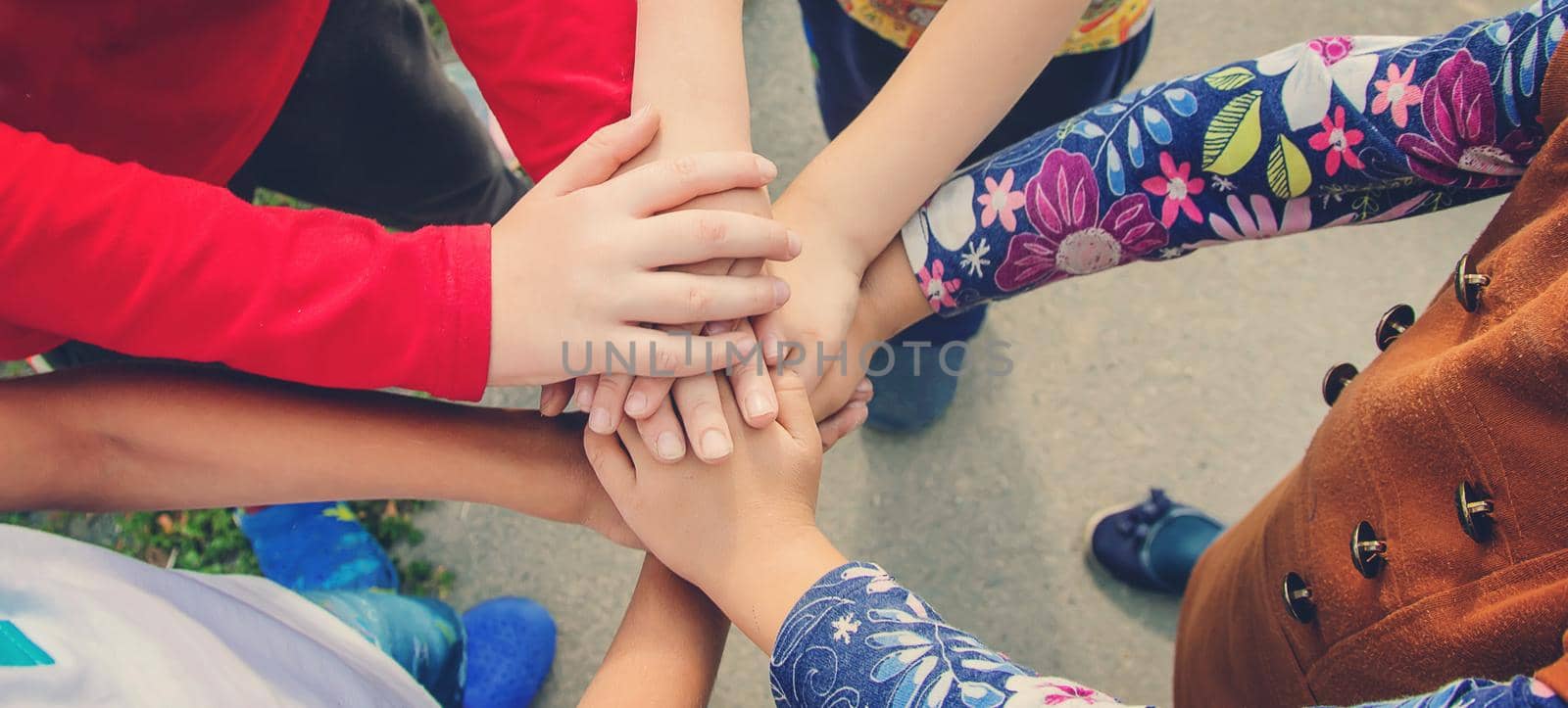 hands of children, many friends, games. Selective focus by yanadjana