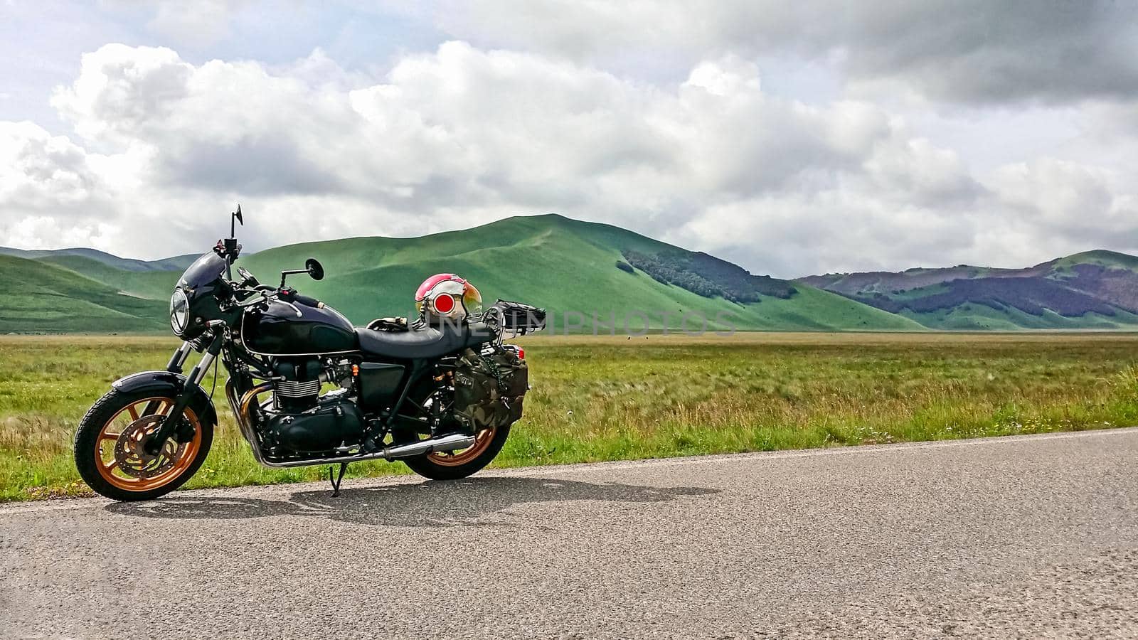 mountainous landscape with parked motorcycle